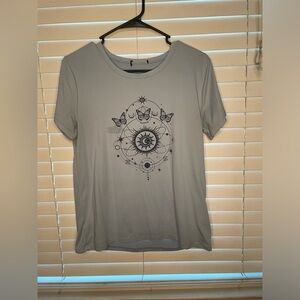 Beautiful light blue tee with butterfly design